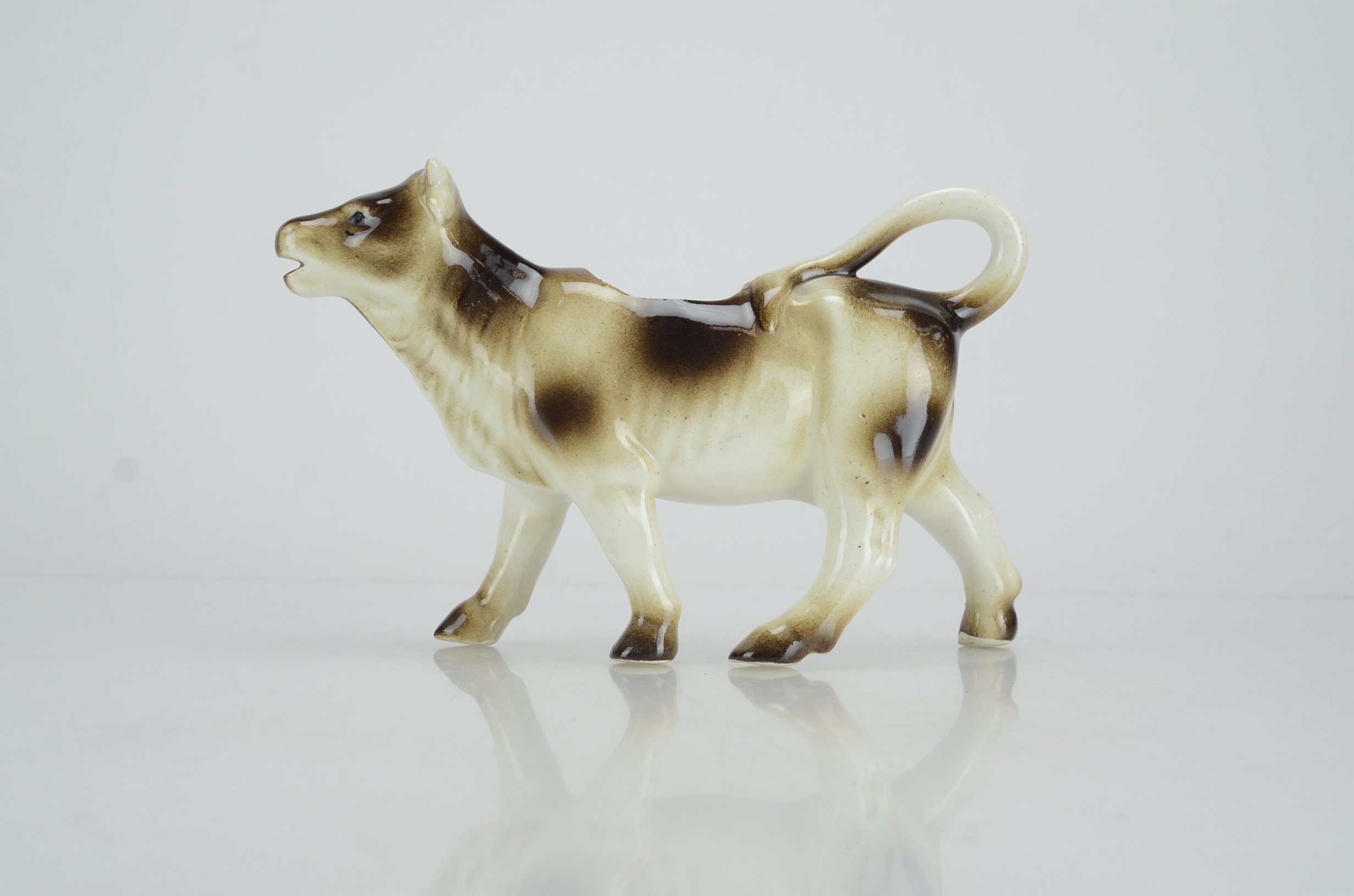 Collection of Four Vintage Cow Figurines