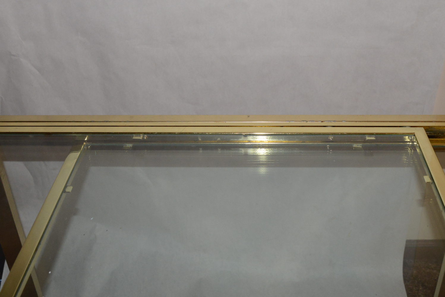 Modern Brass-Tone Dining Table with Glass Top