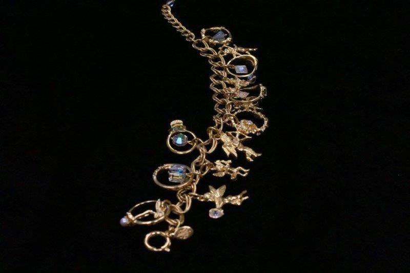 Trio of Gold Colored Charm Bracelets and Necklace