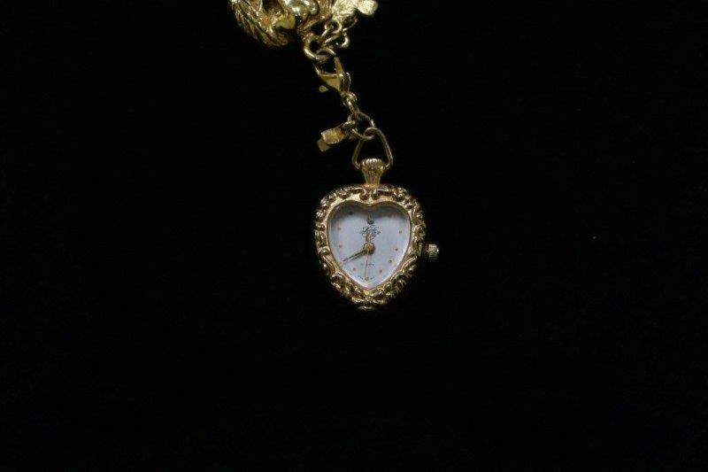 Trio of Gold Colored Charm Bracelets and Necklace