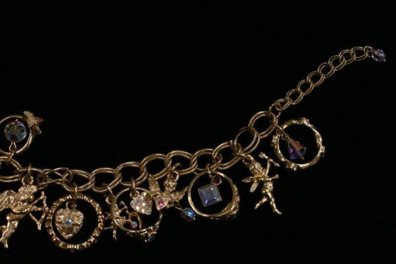 Trio of Gold Colored Charm Bracelets and Necklace