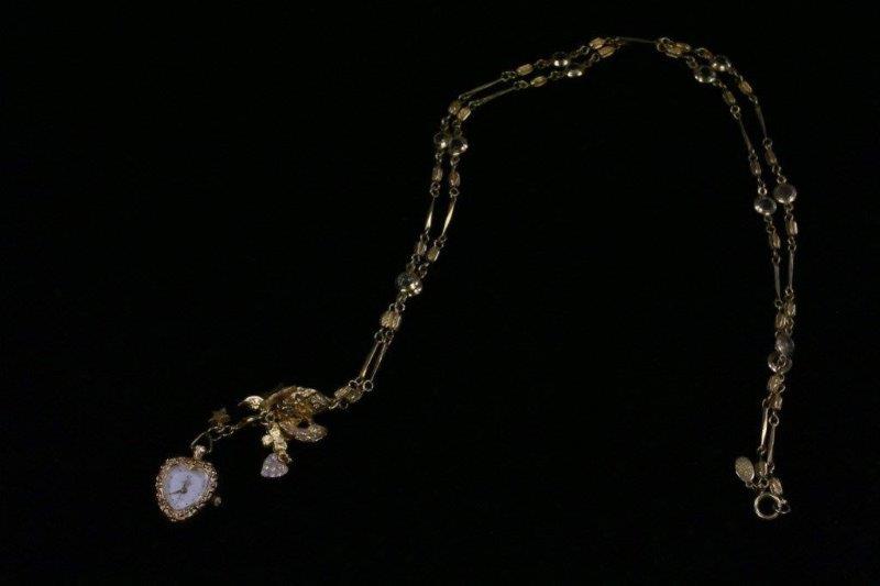 Trio of Gold Colored Charm Bracelets and Necklace