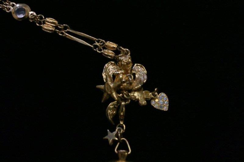 Trio of Gold Colored Charm Bracelets and Necklace