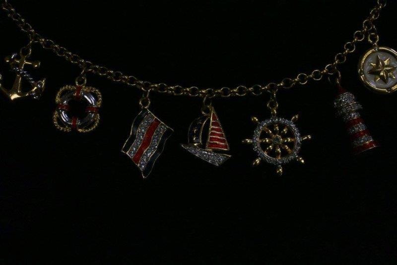 Trio of Gold Colored Charm Bracelets and Necklace