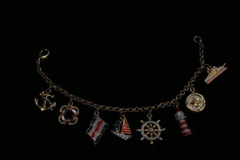 Trio of Gold Colored Charm Bracelets and Necklace