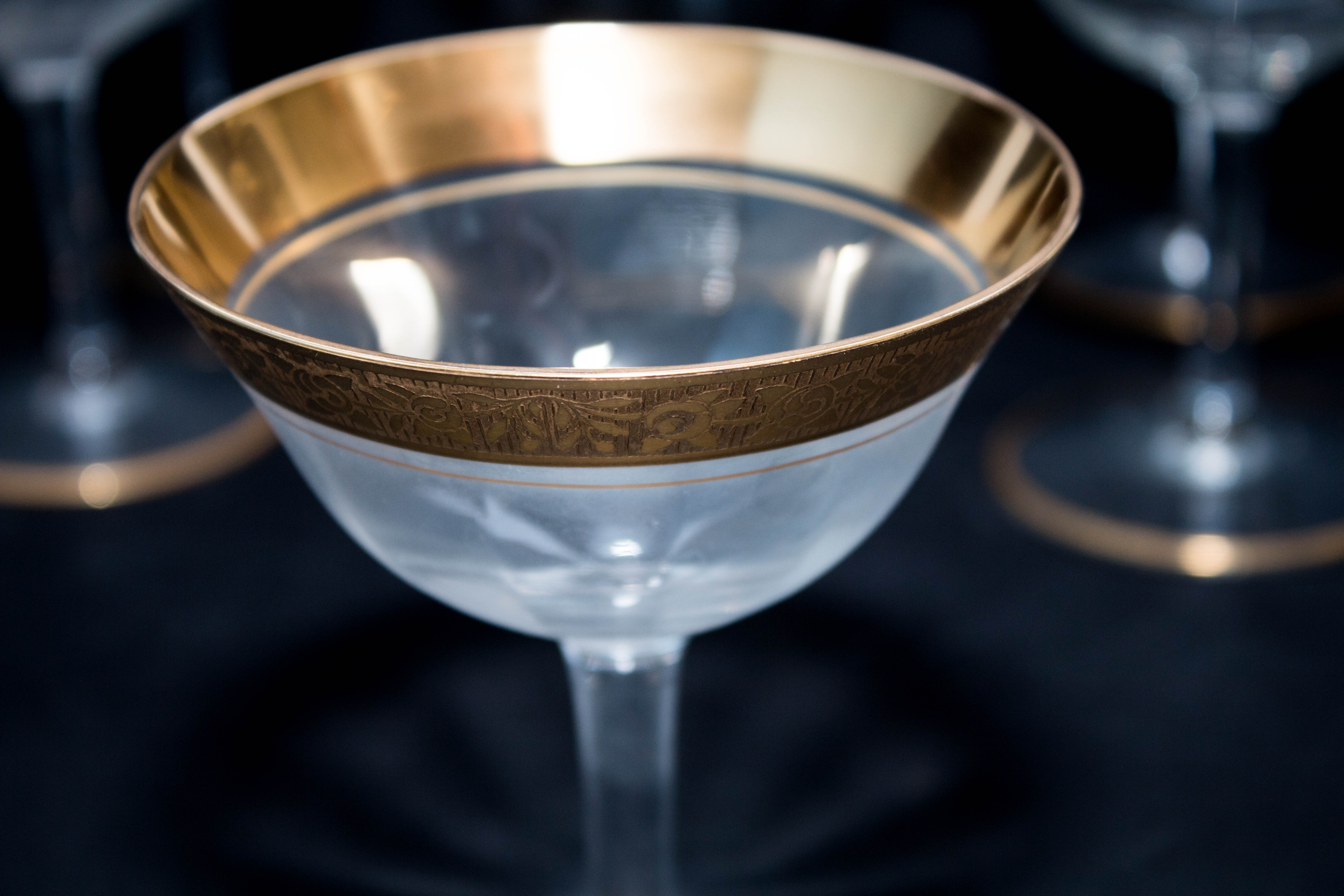 Eight Gold Trimmed Champagne Glasses