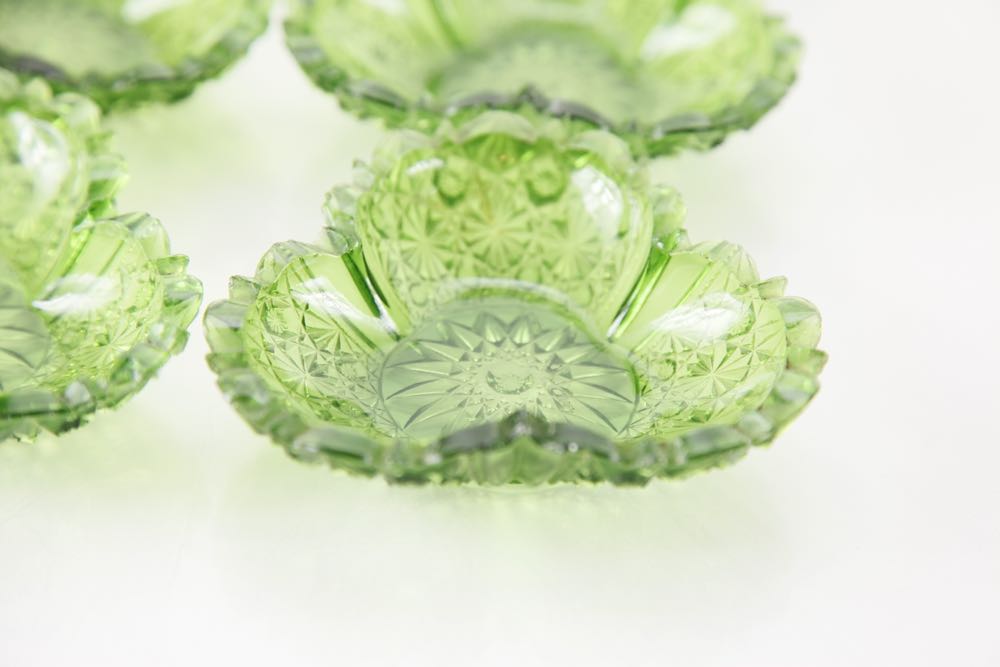 A Group of Dark Green Depression Glass