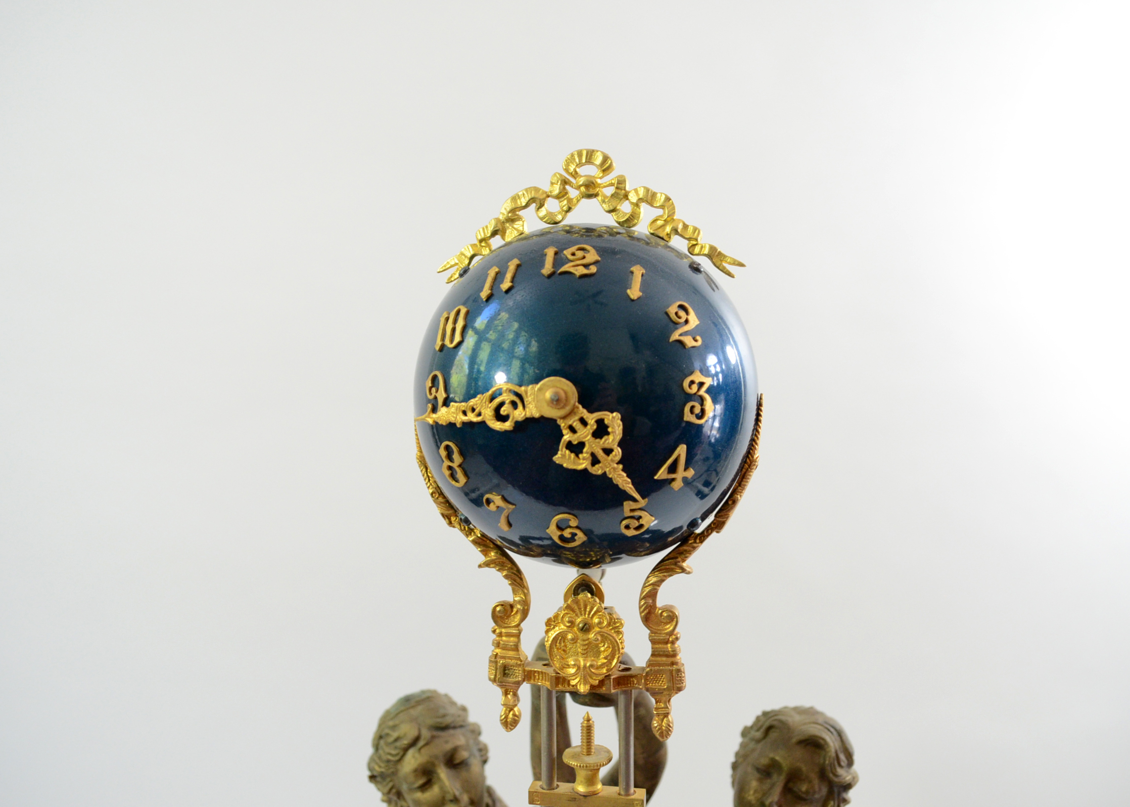Double Swing Arm Clock Featuring Two Women