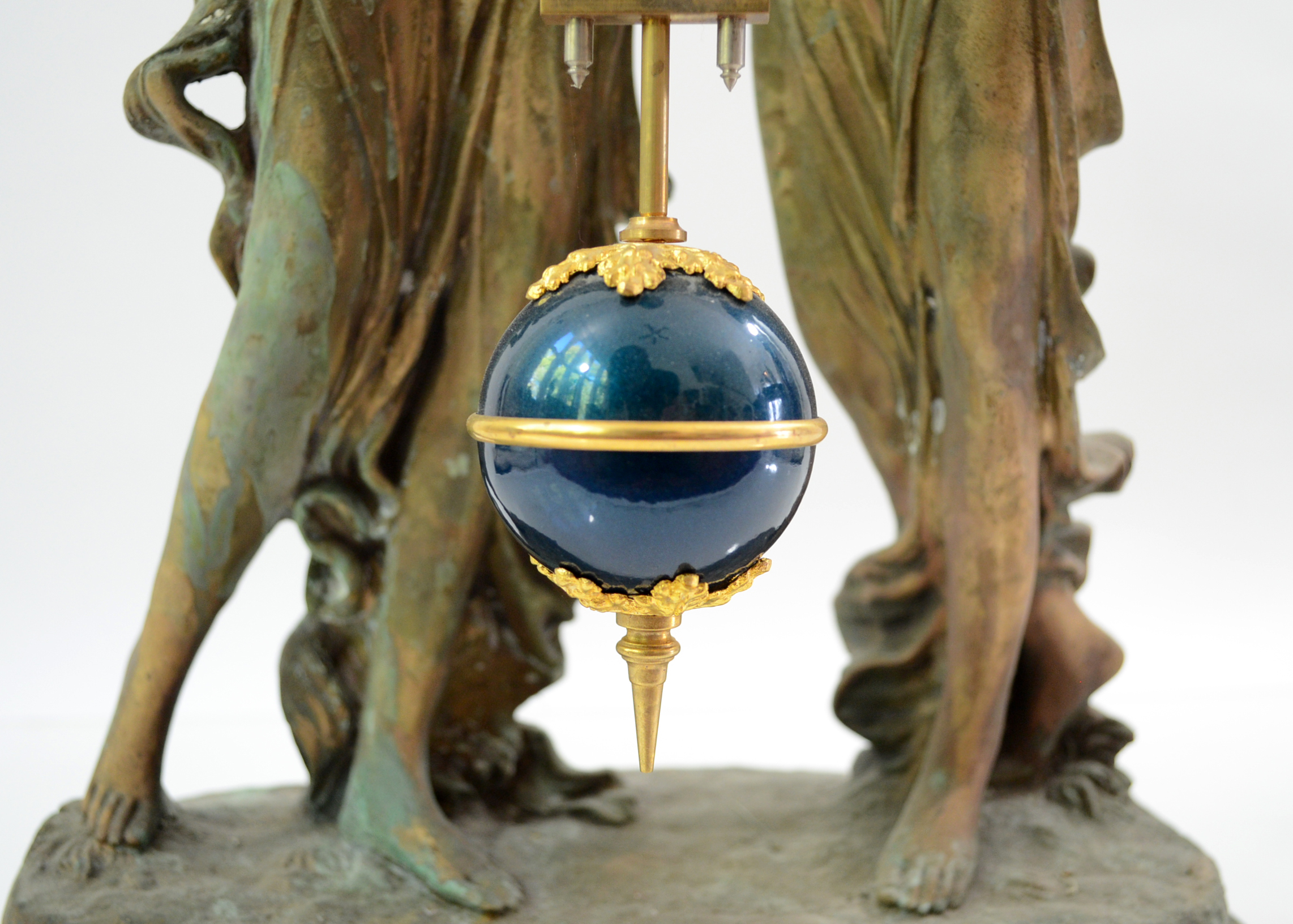 Double Swing Arm Clock Featuring Two Women