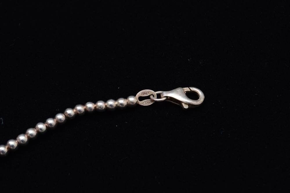 Three Sterling Silver Children's Bracelets and Four Pendants