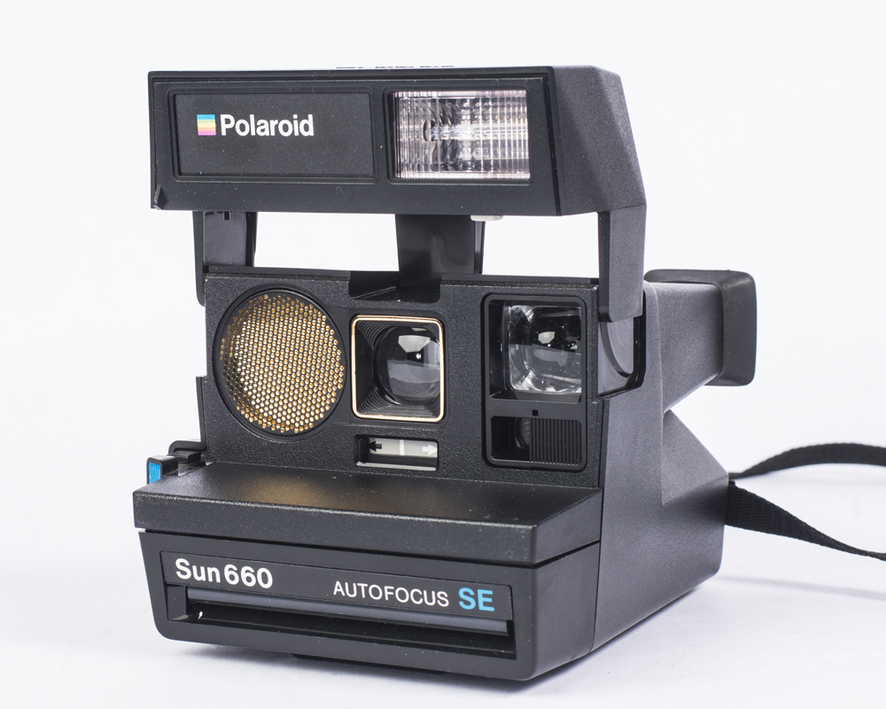Vintage Polaroid Camera and Sony Radio