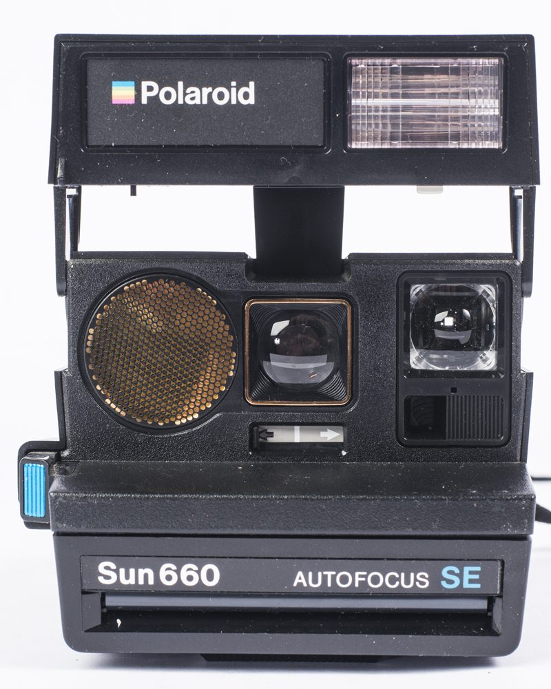 Vintage Polaroid Camera and Sony Radio