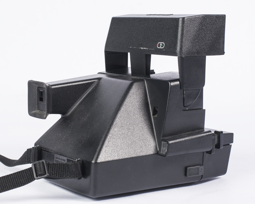 Vintage Polaroid Camera and Sony Radio