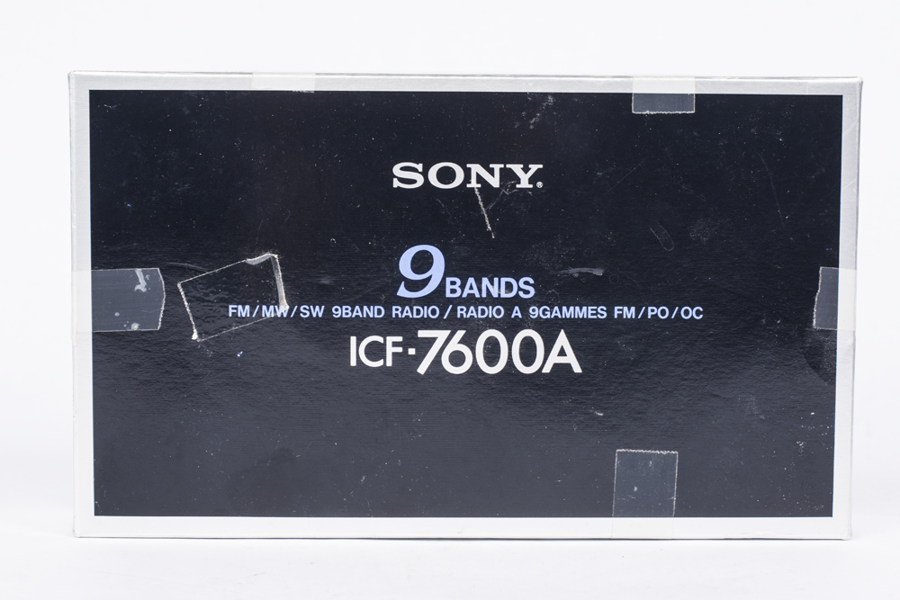 Vintage Polaroid Camera and Sony Radio