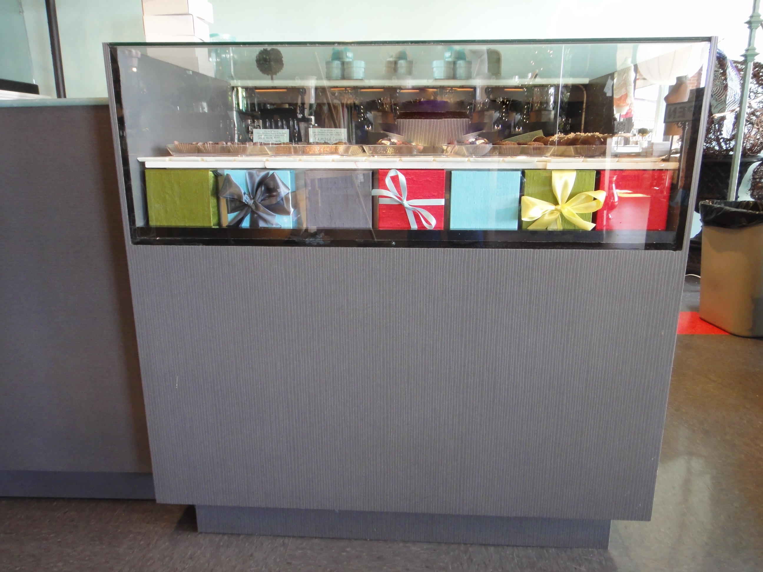 Custom Lighted Showcase by Thomas Cabinets Corian Ledge