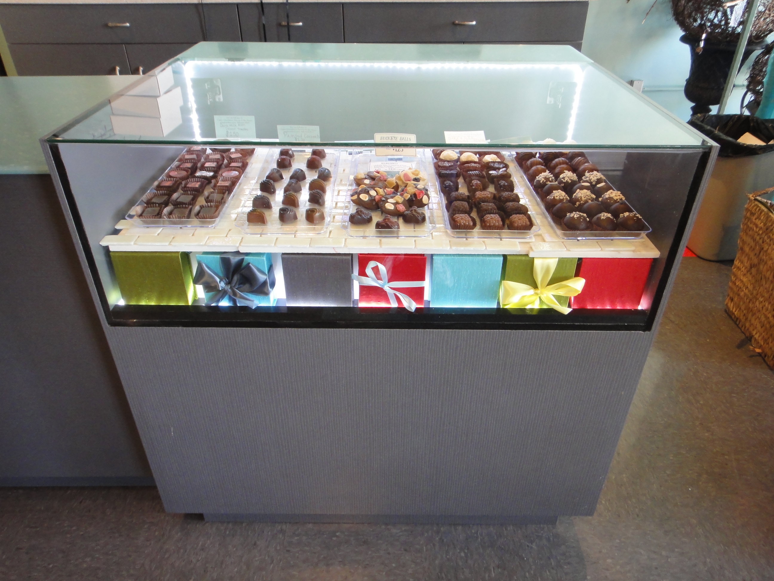 Custom Lighted Showcase by Thomas Cabinets Corian Ledge