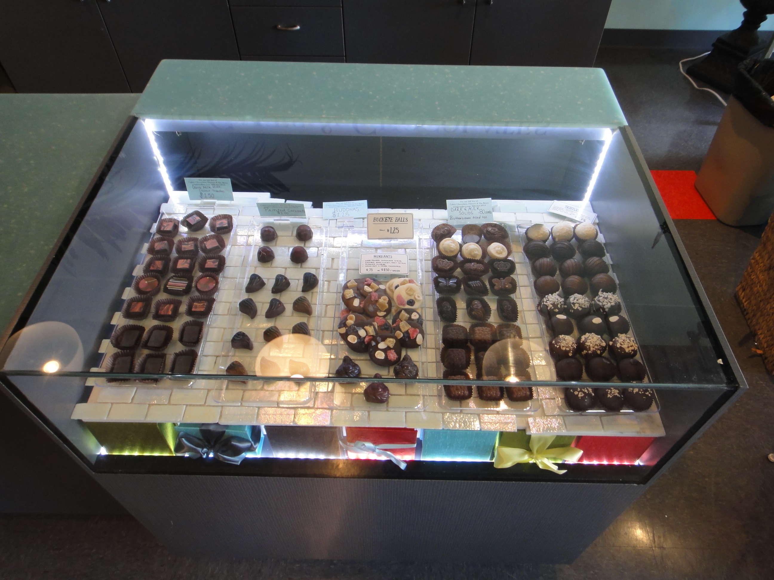 Custom Lighted Showcase by Thomas Cabinets Corian Ledge