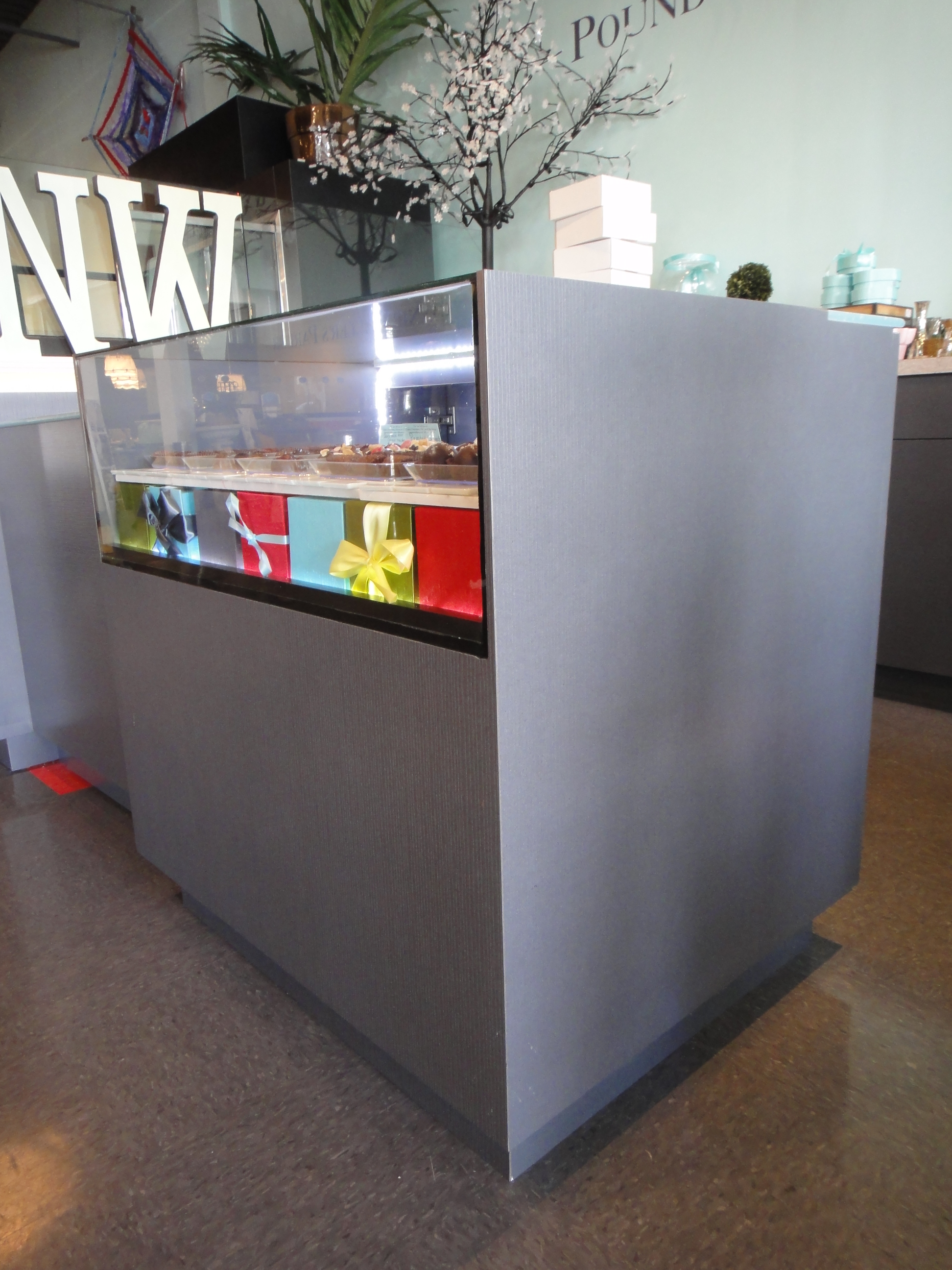 Custom Lighted Showcase by Thomas Cabinets Corian Ledge