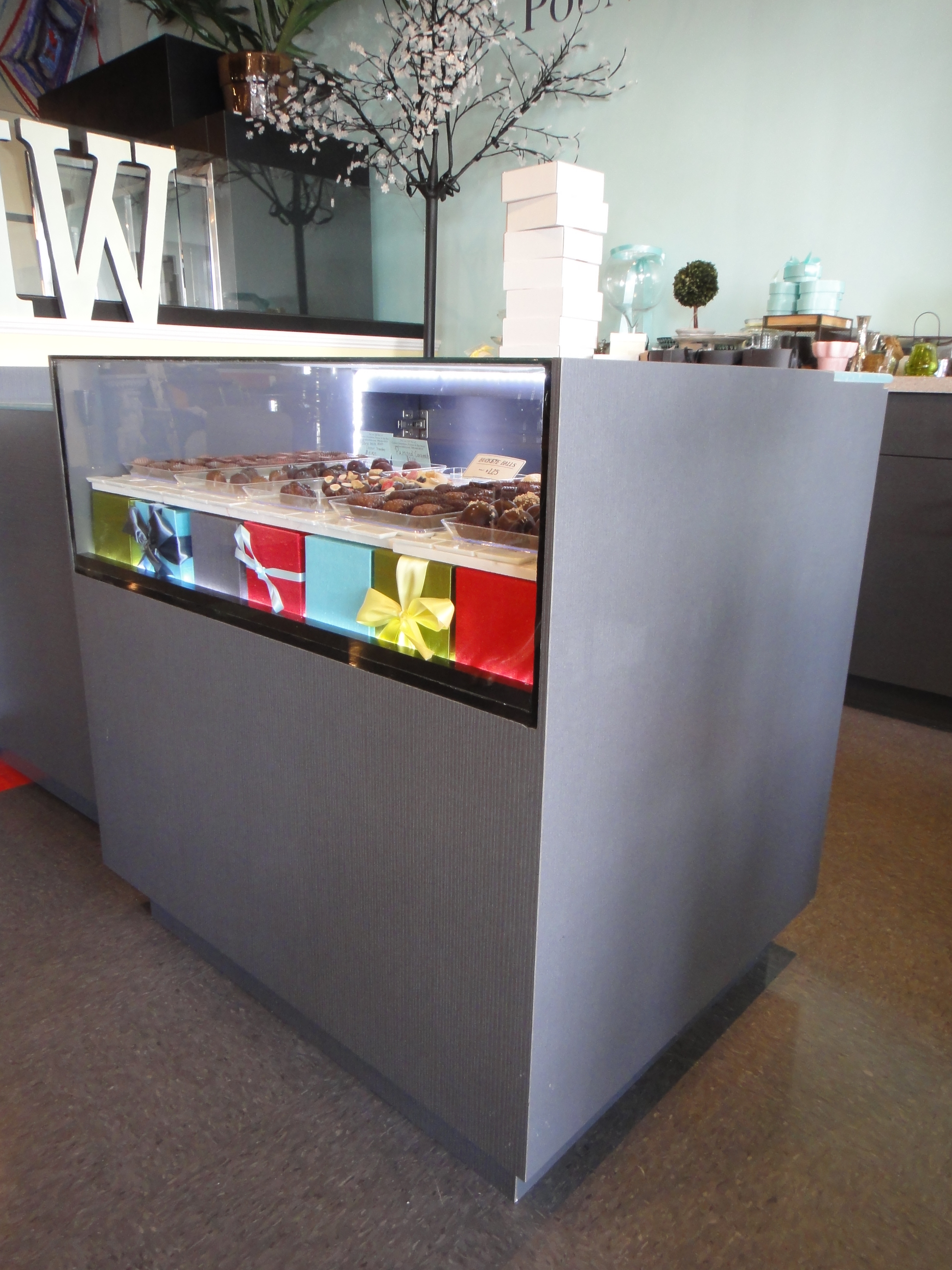Custom Lighted Showcase by Thomas Cabinets Corian Ledge
