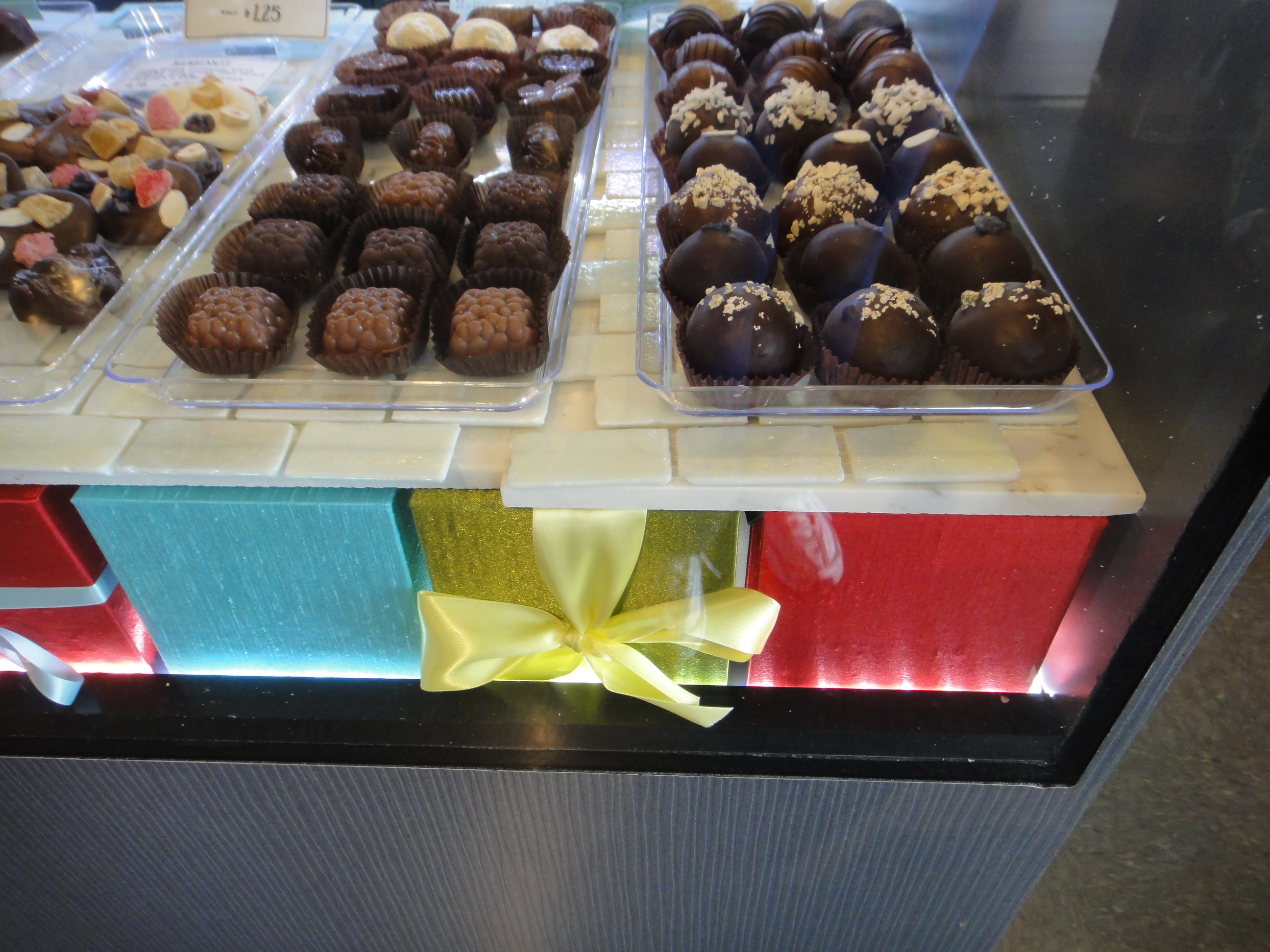 Custom Lighted Showcase by Thomas Cabinets Corian Ledge