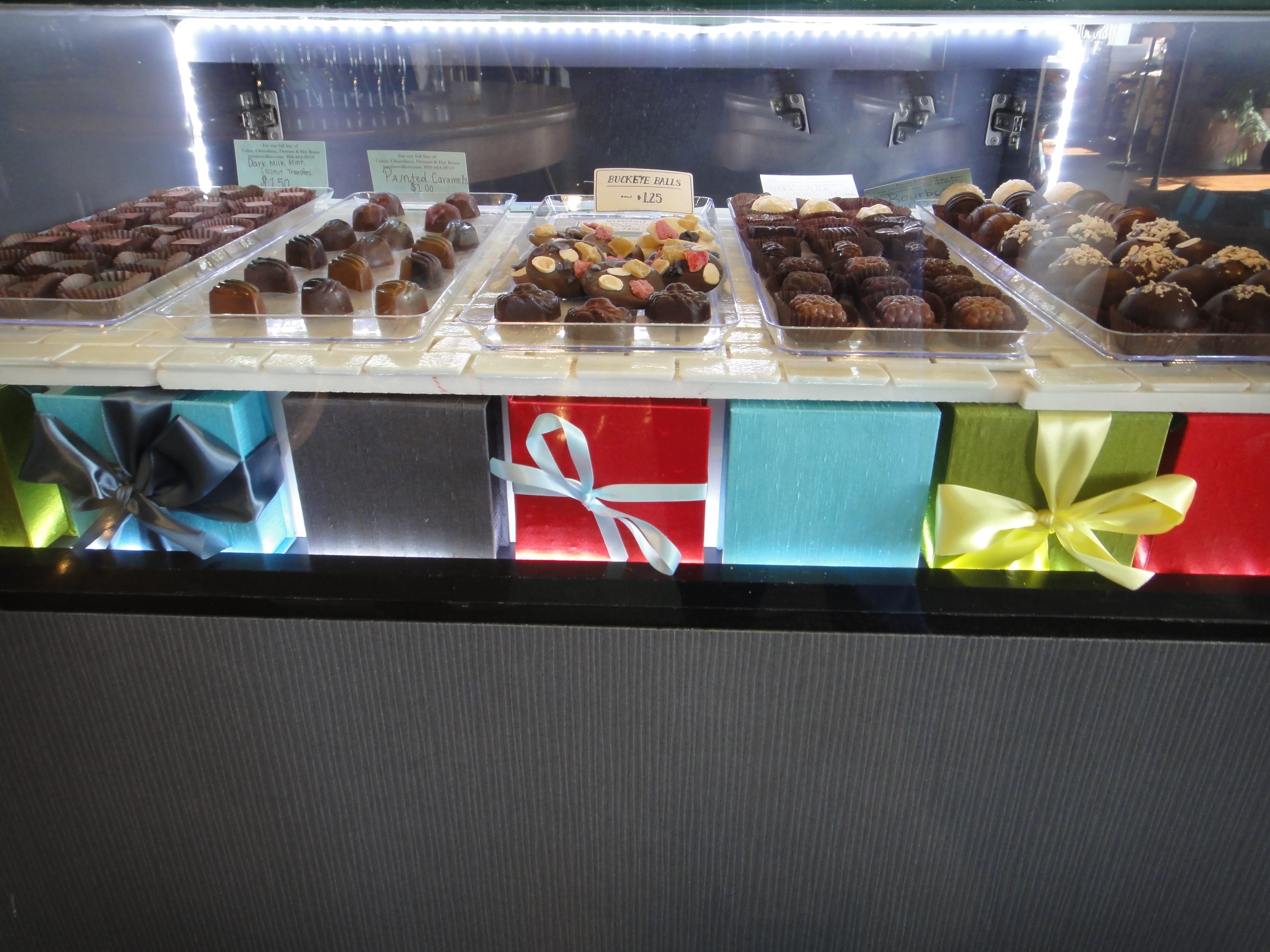 Custom Lighted Showcase by Thomas Cabinets Corian Ledge