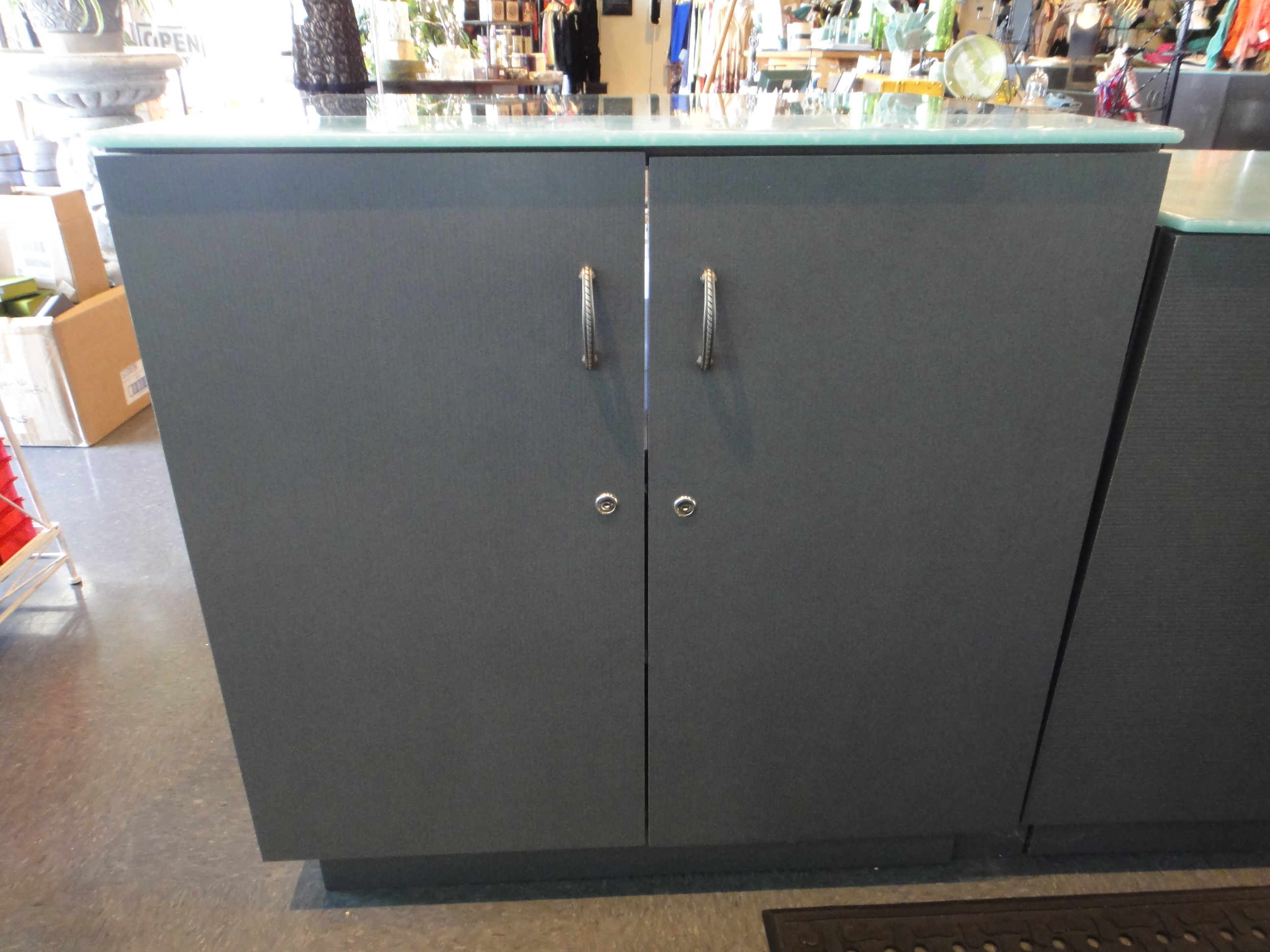 Custom Lighted Showcase by Thomas Cabinets Corian Ledge