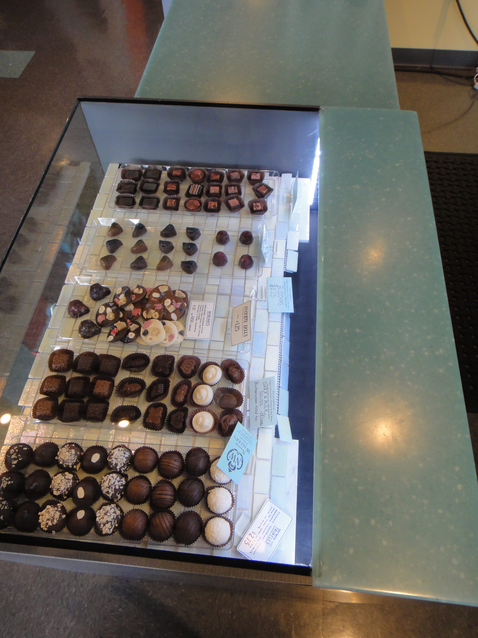 Custom Lighted Showcase by Thomas Cabinets Corian Ledge