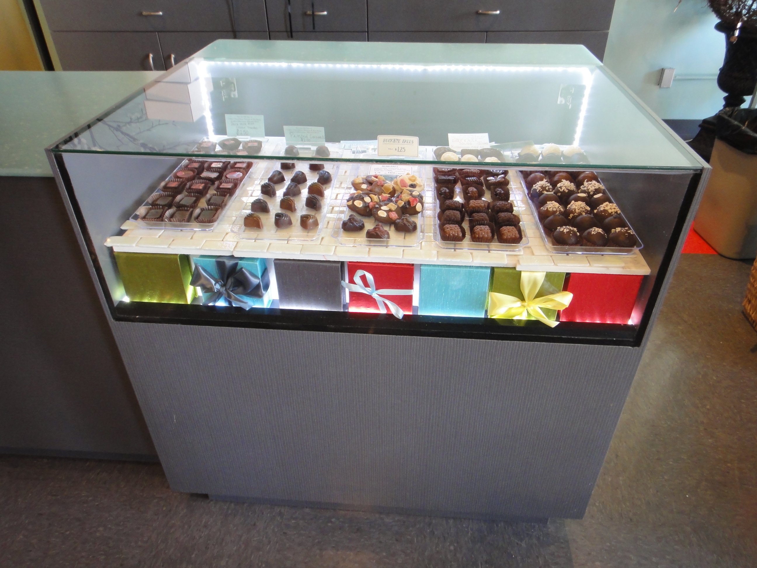 Custom Lighted Showcase by Thomas Cabinets Corian Ledge