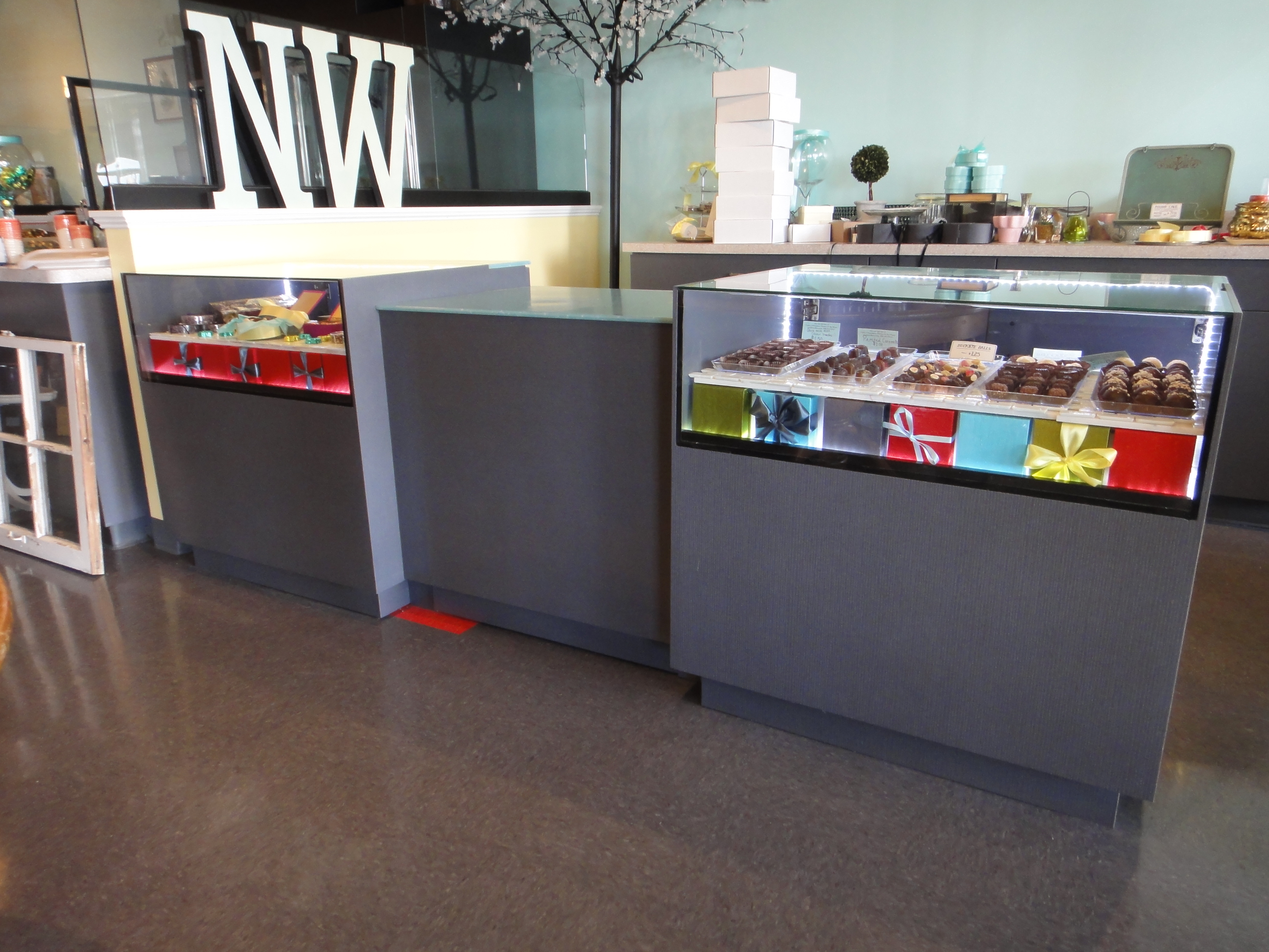 Custom Lighted Showcase by Thomas Cabinets Corian Ledge