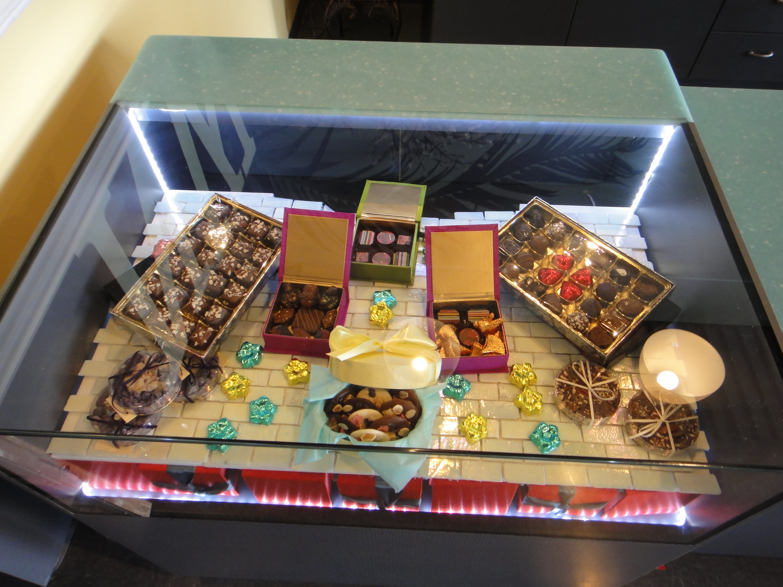 Custom Lighted Showcase by Thomas Cabinets Corian Ledge