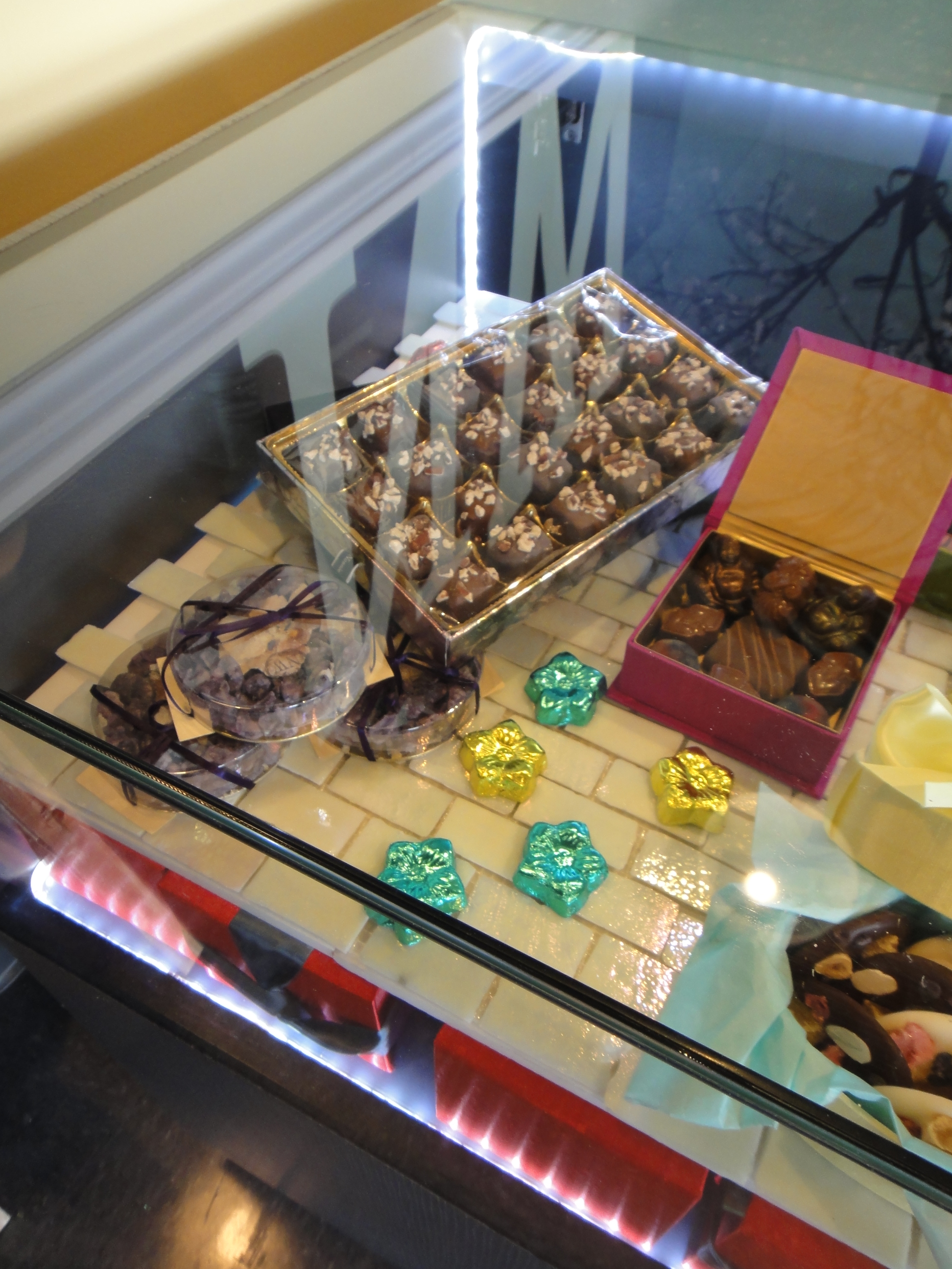 Custom Lighted Showcase by Thomas Cabinets Corian Ledge