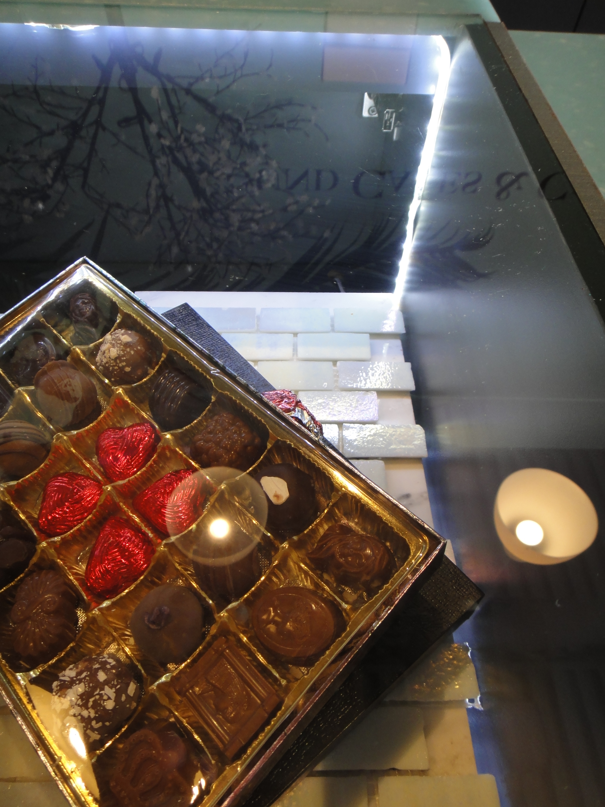 Custom Lighted Showcase by Thomas Cabinets Corian Ledge