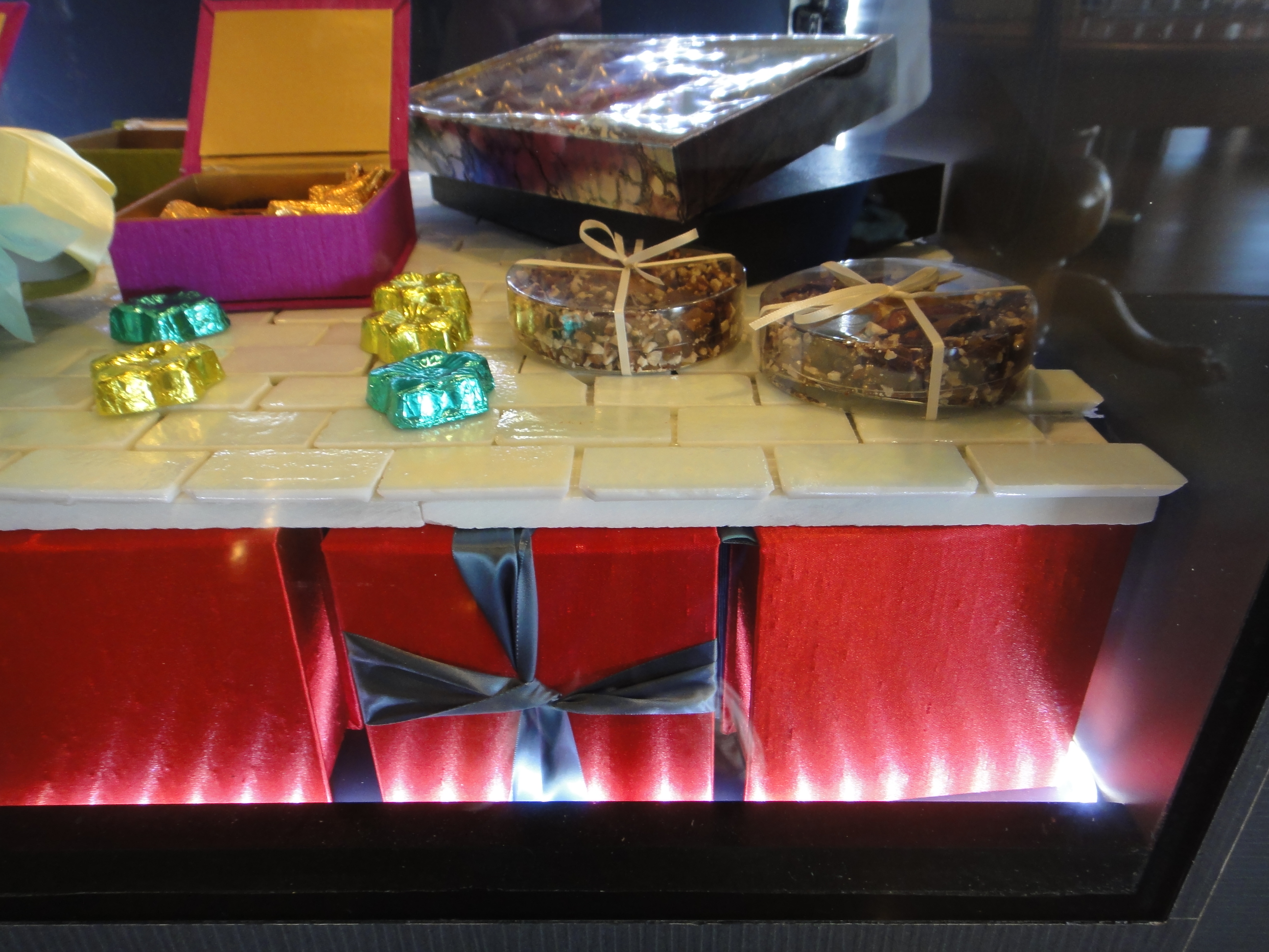 Custom Lighted Showcase by Thomas Cabinets Corian Ledge