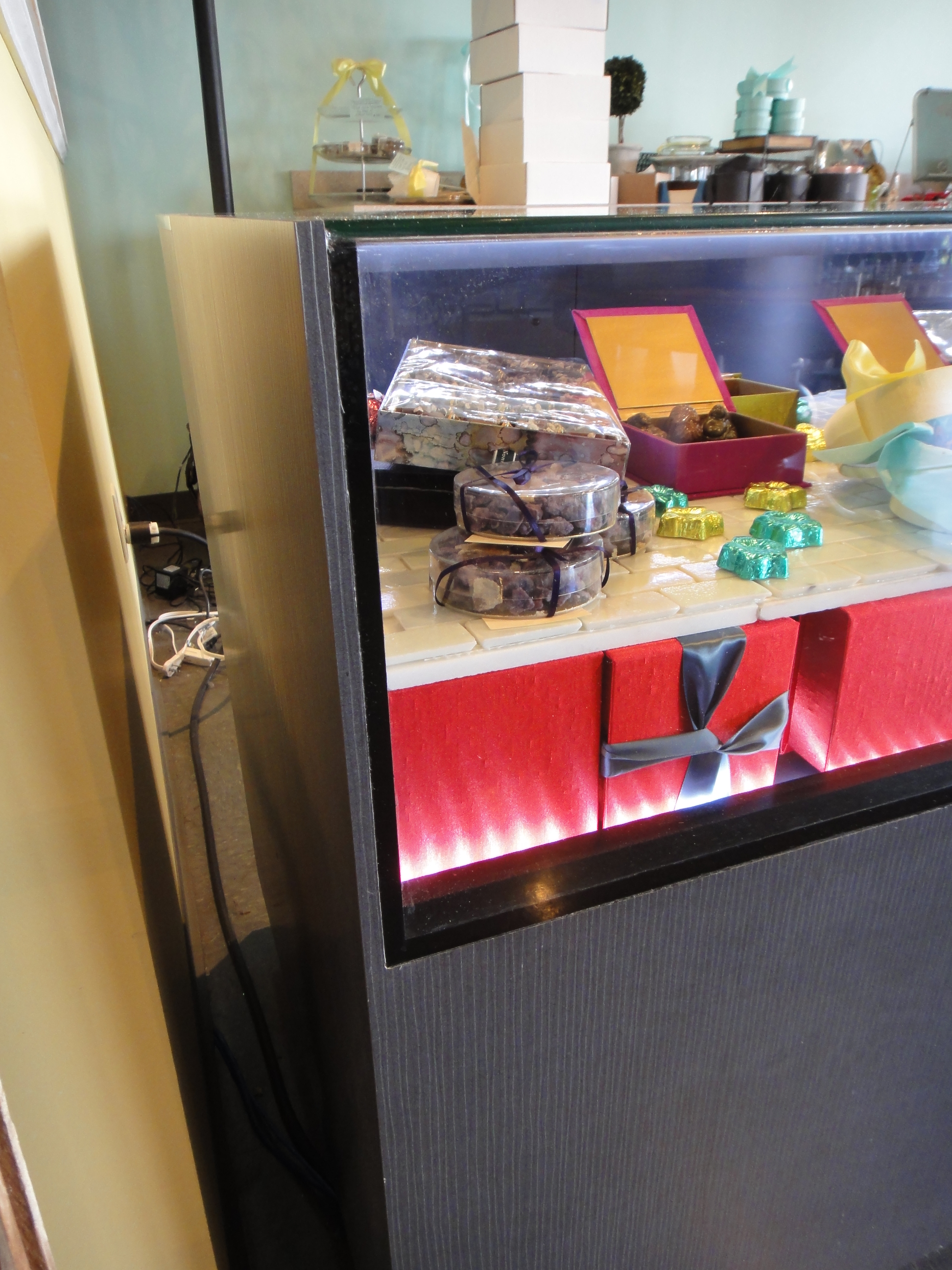 Custom Lighted Showcase by Thomas Cabinets Corian Ledge