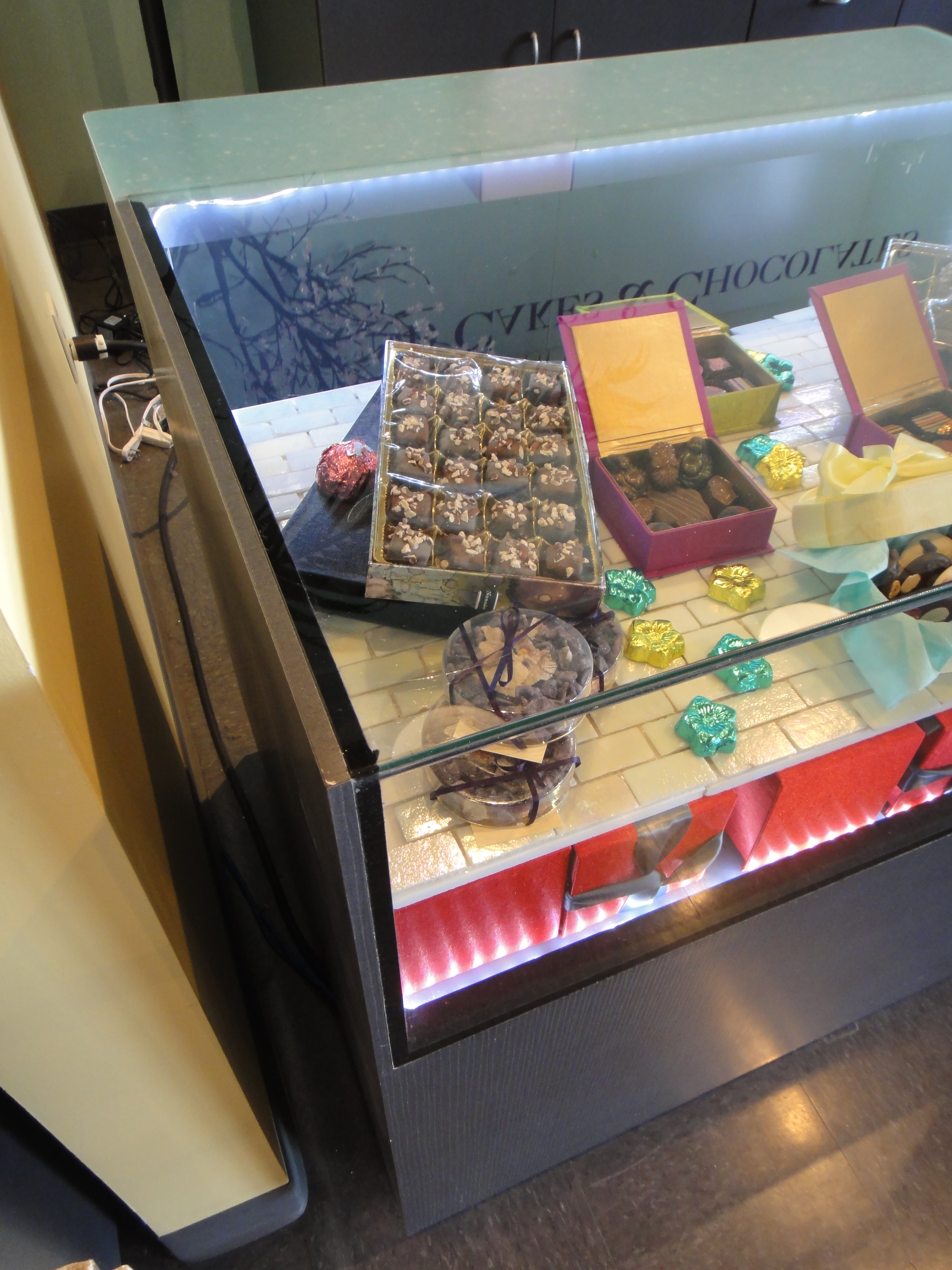 Custom Lighted Showcase by Thomas Cabinets Corian Ledge