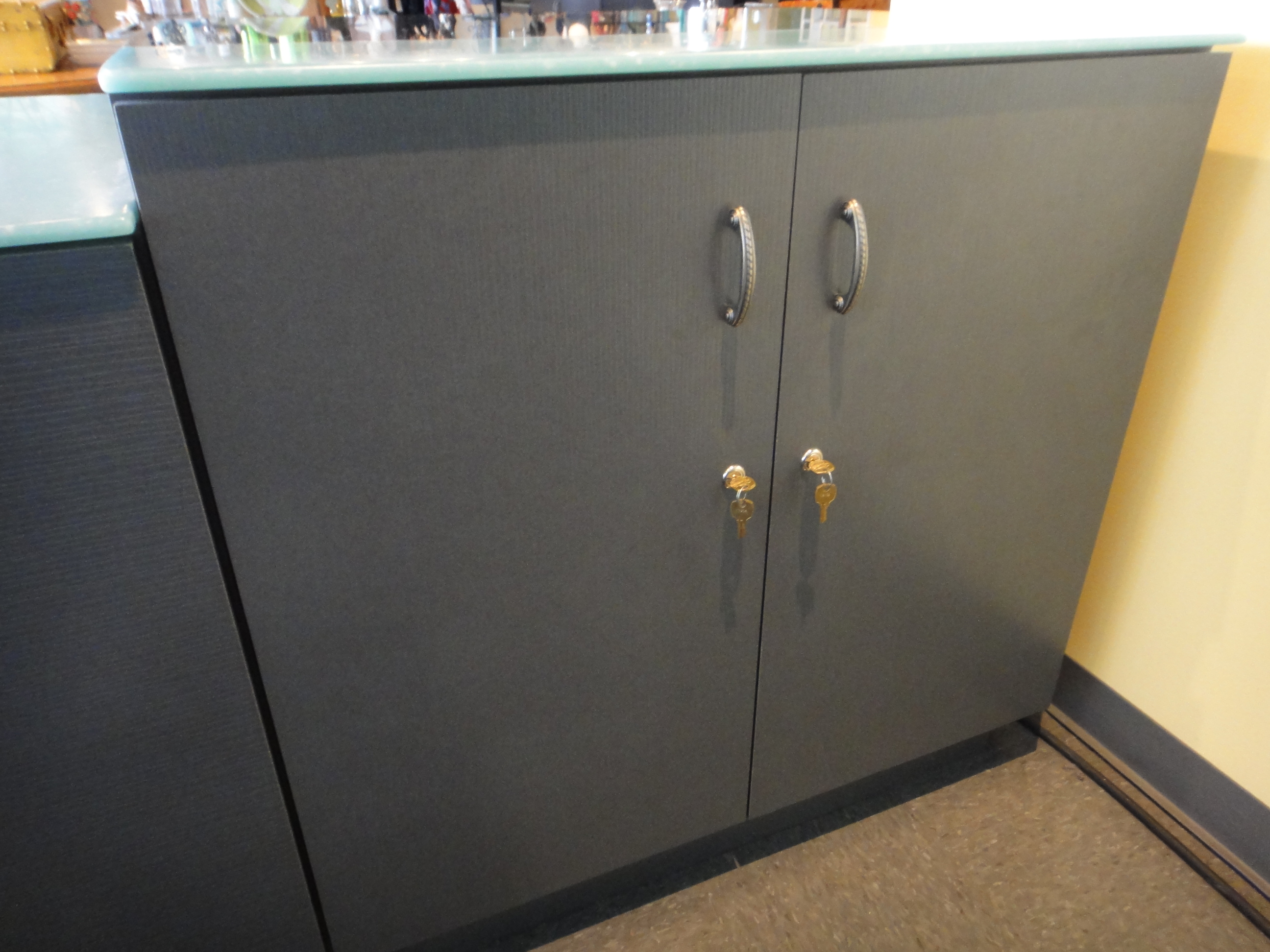 Custom Lighted Showcase by Thomas Cabinets Corian Ledge