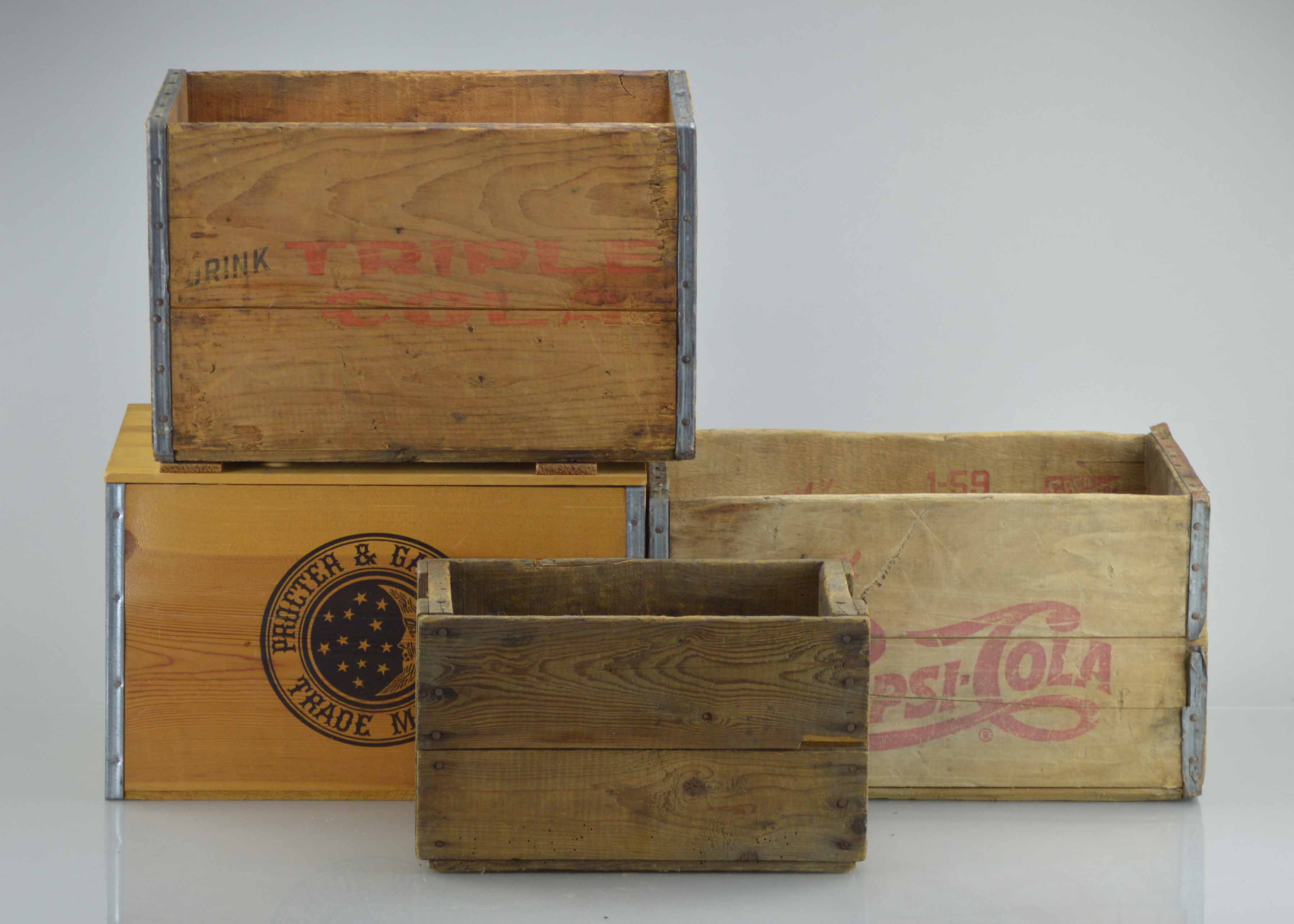 Assortment Of Vintage Wooden Crates With Advertisements