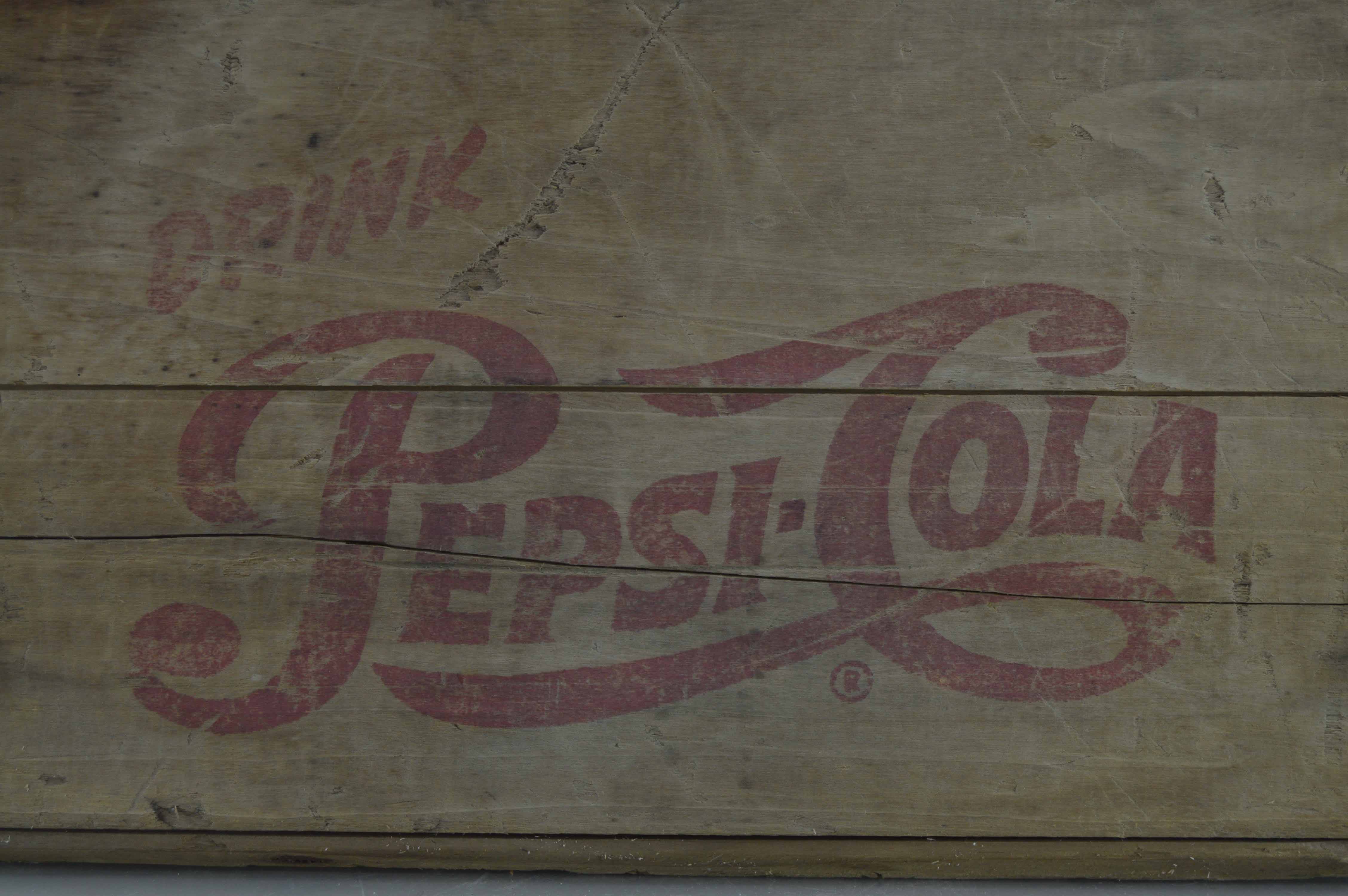 Assortment Of Vintage Wooden Crates With Advertisements