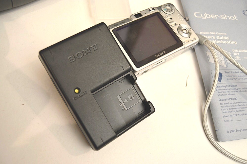 Sharper Image Computer Bag, Sony Cyper-Shot Camera, RCA Mini TV