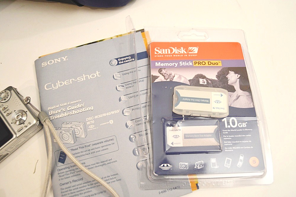 Sharper Image Computer Bag, Sony Cyper-Shot Camera, RCA Mini TV