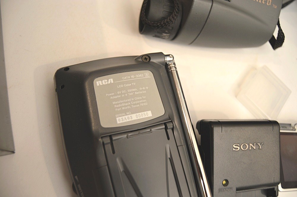 Sharper Image Computer Bag, Sony Cyper-Shot Camera, RCA Mini TV