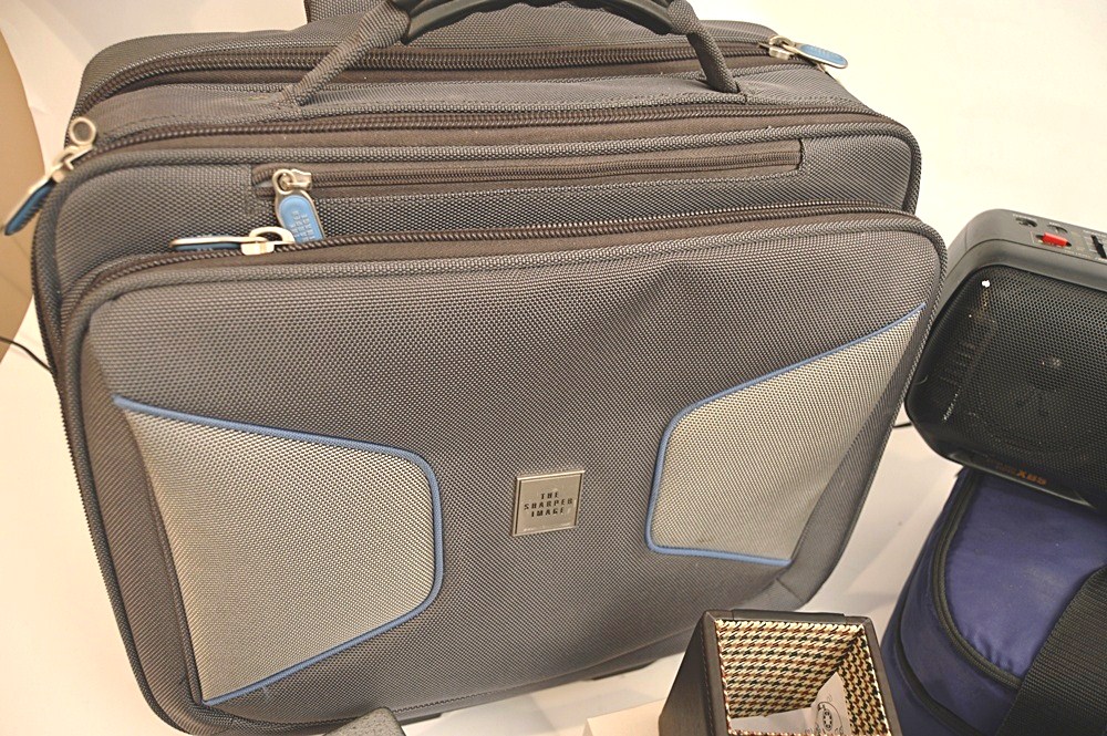 Sharper Image Computer Bag, Sony Cyper-Shot Camera, RCA Mini TV