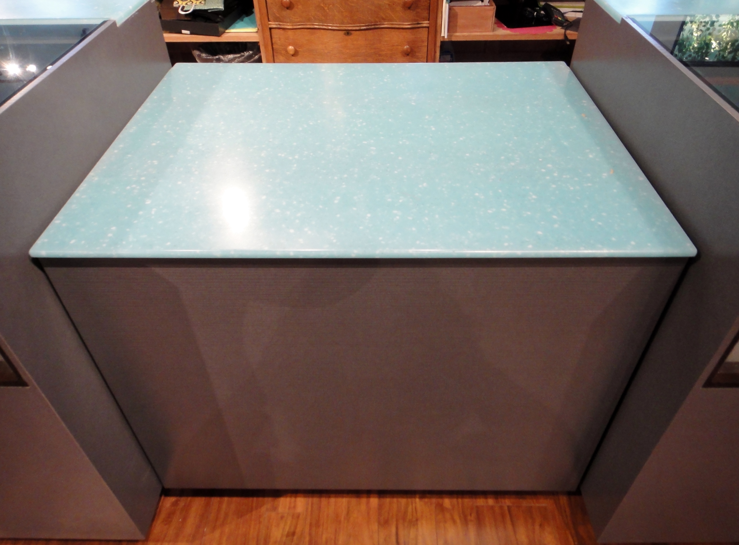 Custom Center Cabinet by Thomas Cabinet Shop Inc. Corian Top
