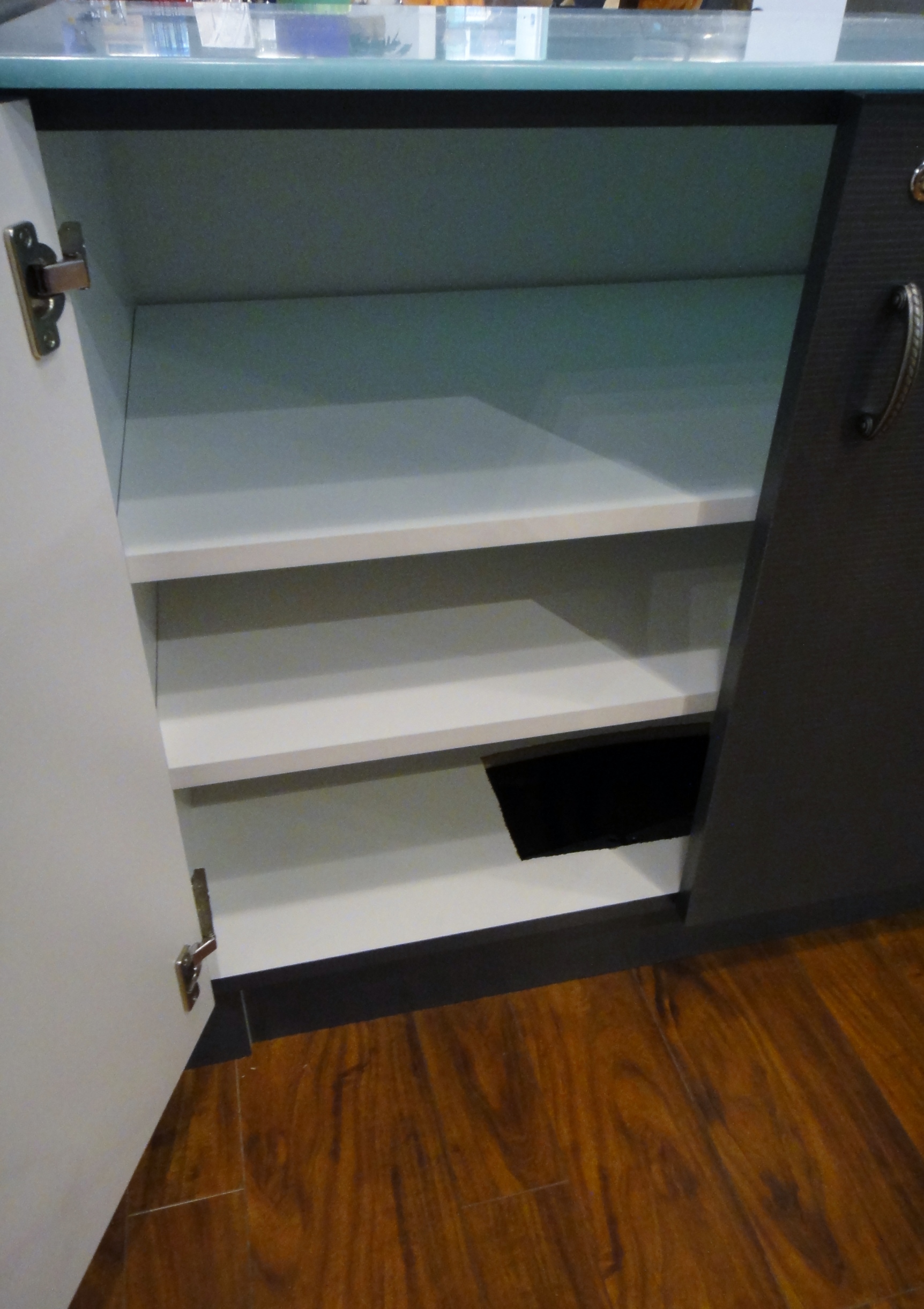 Custom Center Cabinet by Thomas Cabinet Shop Inc. Corian Top