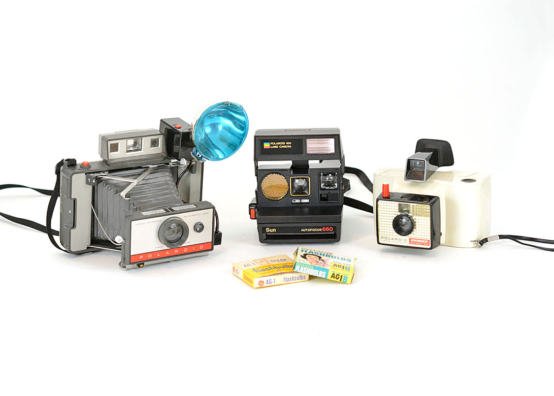 Trio of Polaroid Cameras with Flashgun