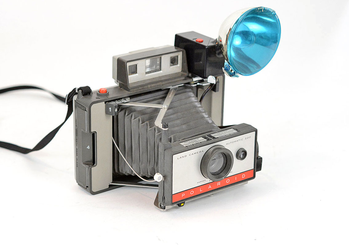 Trio of Polaroid Cameras with Flashgun