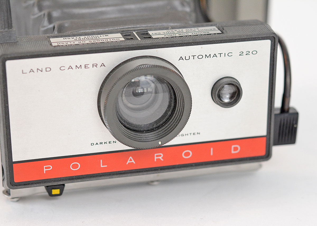 Trio of Polaroid Cameras with Flashgun