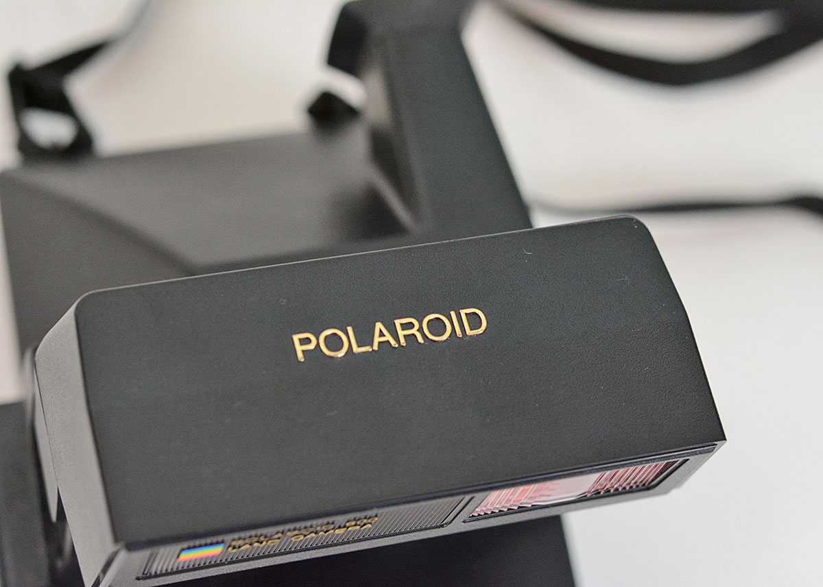 Trio of Polaroid Cameras with Flashgun