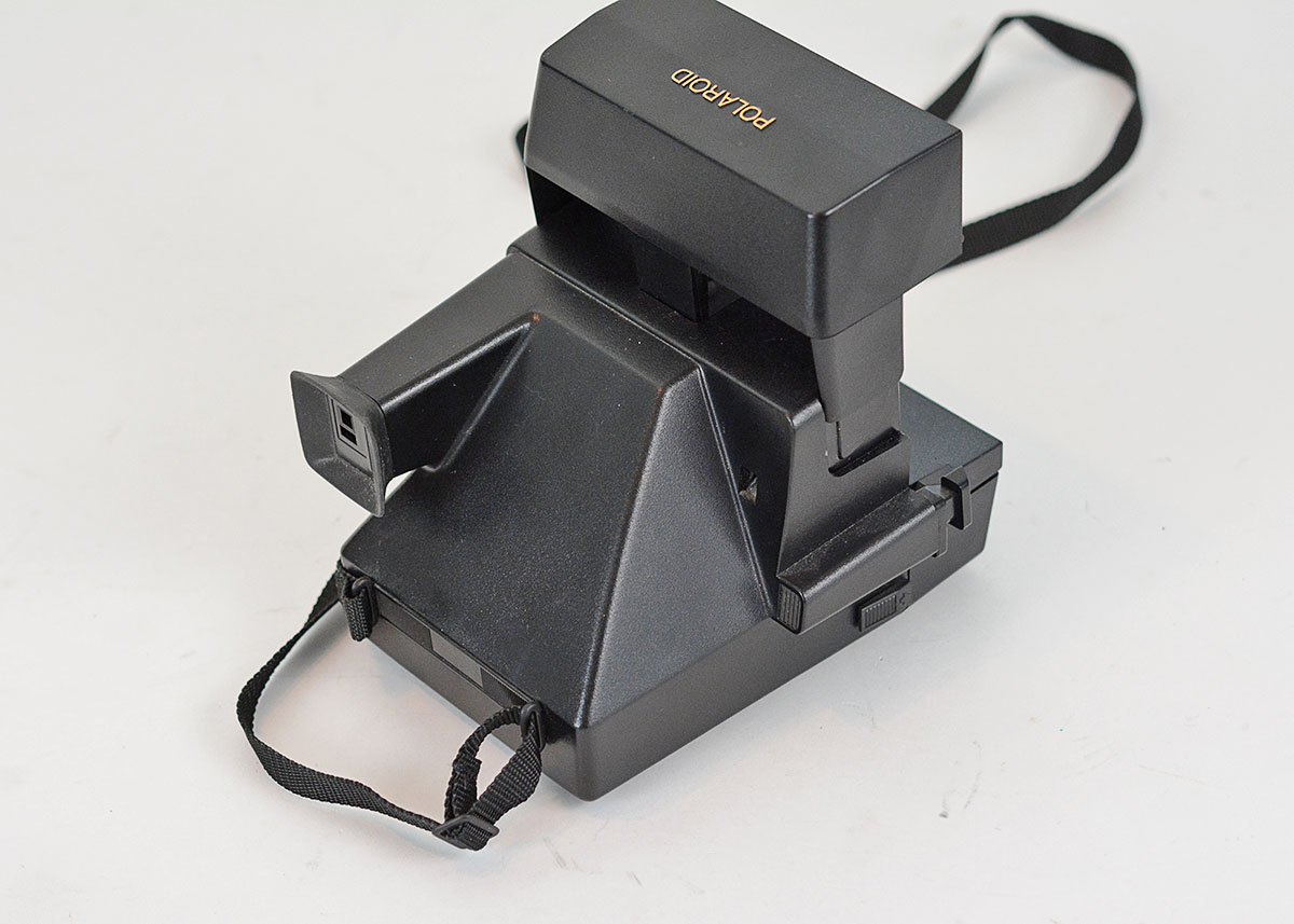 Trio of Polaroid Cameras with Flashgun