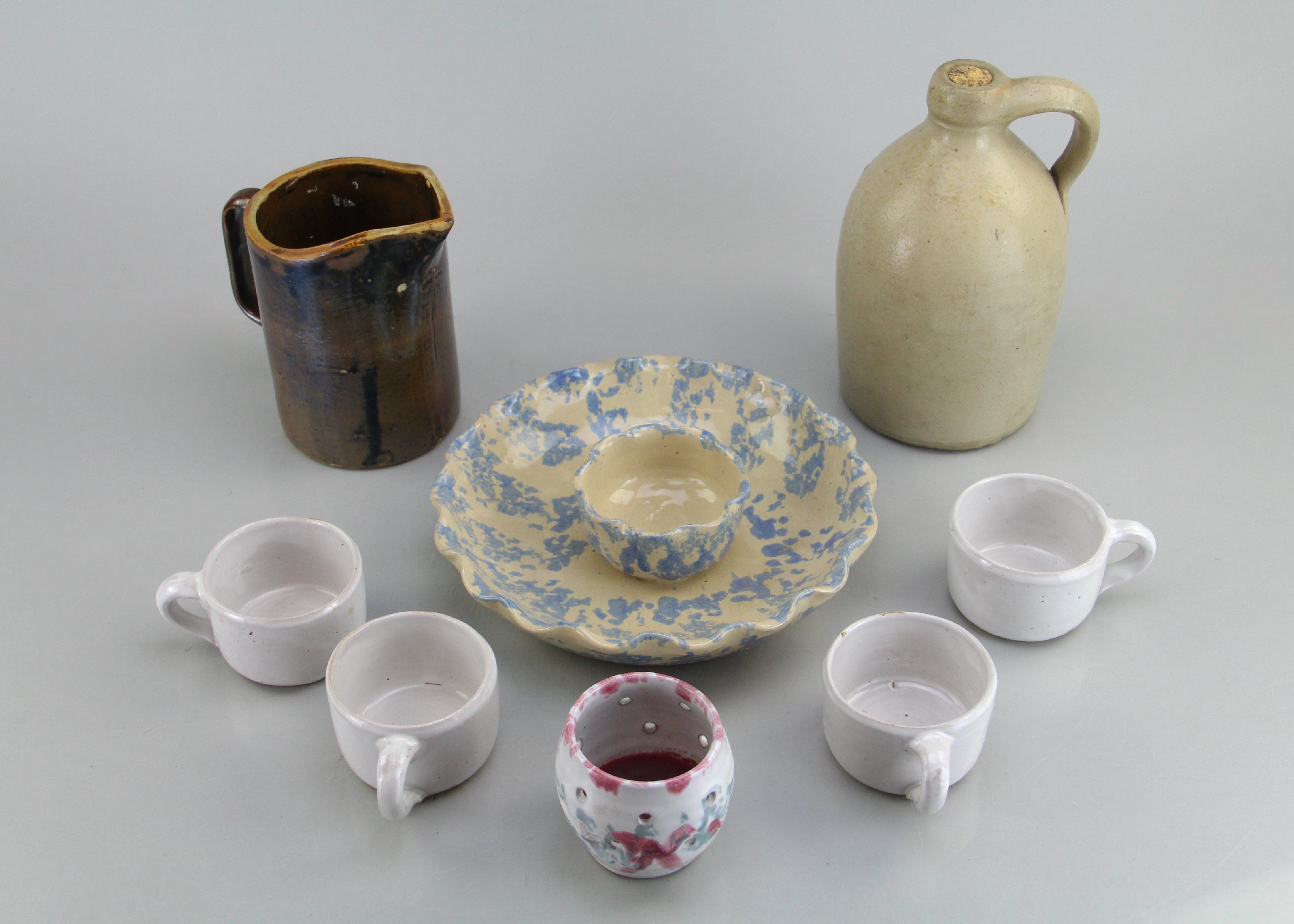 Assorted Ceramic Ware Including Cups, Pitcher, Tray, And Jug